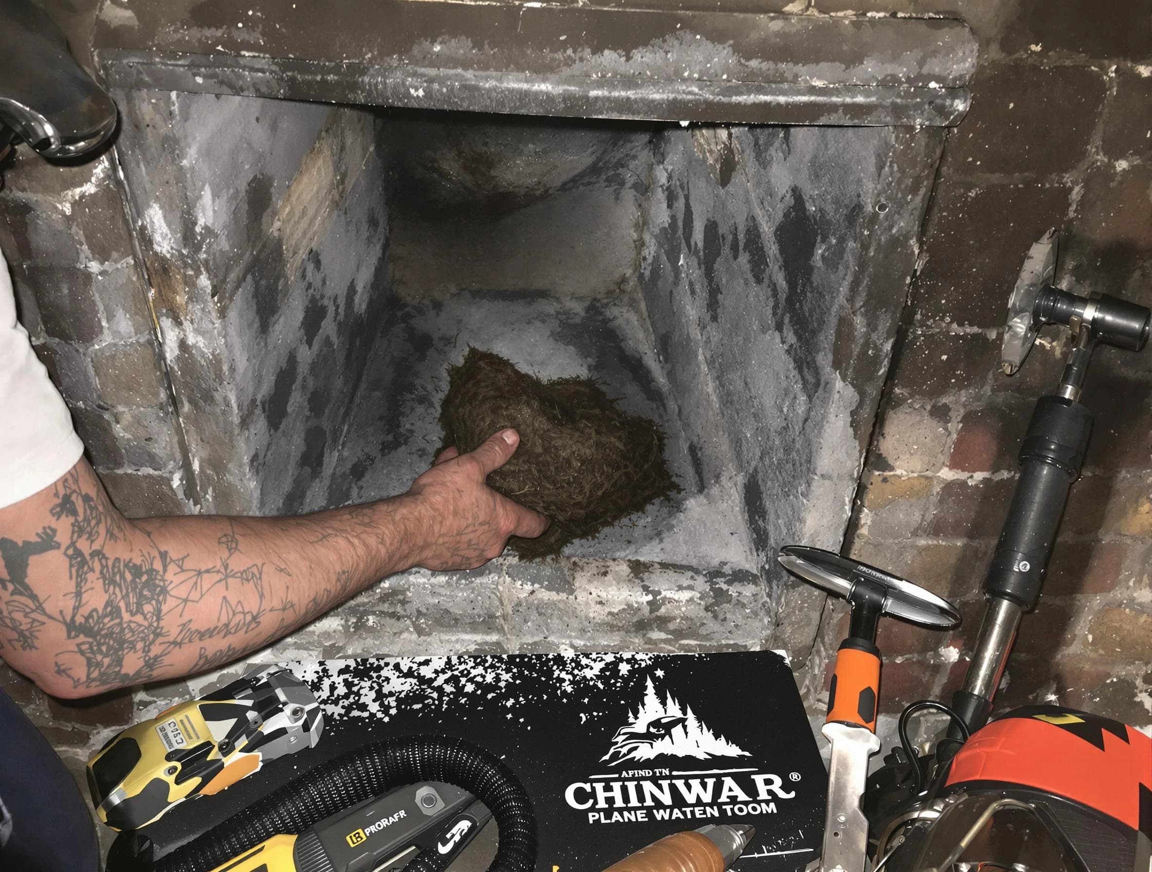 Methuen Town Chimney Sweep safely removing debris and screening chimney in Methuen Town, MA